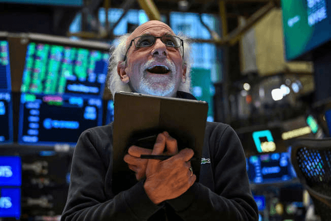 A trader works on the floor of the New York Stock Exchange (NYSE) during afternoon trading on April 9, 2025 in New York. Wall Street stocks rocketed to close solidly higher Wednesday, with dramatic advances on all three major indexes as US President Donald Trump delayed steep new tariffs hours after they took effect. The Dow Jones Industrial Average surged 7.9 percent to 40,608.45, the broad-based S&P 500 Index rallied 9.5 percent to 5,456.90, and the tech-focused Nasdaq Composite Index jumped more than 12.2 percent to 17,124.97