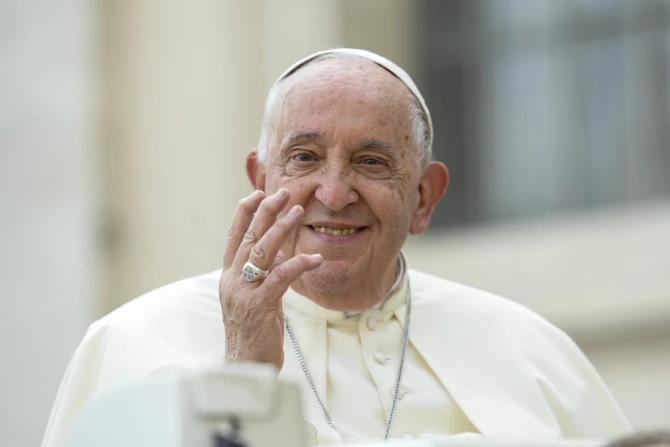 Pope Francis waves to pilgrims at his Wednesday general audience in St. Peter’s Square at the Vatican
